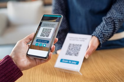 customer-hand-scanning-qr-code-with-phone-PAY